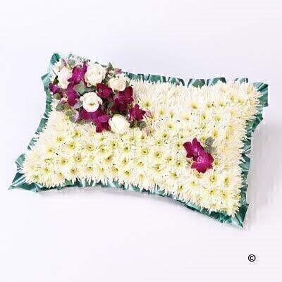 <h2>Classic White Pillow | Funeral Flowers</h2>
<ul>
<li>Approximate Size W 30cm H 55cm</li>
<li>Hand created classic white pillow in fresh flowers</li>
<li>To give you the best we may occasionally need to make substitutes</li>
<li>Funeral Flowers will be delivered at least 2 hours before the funeral</li>
<li>For delivery area coverage see below</li>
</ul>
<h2><br />Liverpool Flower Delivery</h2>
<p>We have a wide selection of Funeral Pillows offered for Liverpool Flower Delivery. Funeral Pillows can be provided for you in Liverpool, Merseyside and we can organize Funeral flower deliveries for you nationwide. Funeral Flowers can be delivered to the Funeral directors or a house address. They can not be delivered to the crematorium or the church.</p>
<br>
<h2>Flower Delivery Coverage</h2>
<p>Our shop delivers funeral flowers to the following Liverpool postcodes L1 L2 L3 L4 L5 L6 L7 L8 L11 L12 L13 L14 L15 L16 L17 L18 L19 L24 L25 L26 L27 L36 L70 If your order is for an area outside of these we can organise delivery for you through our network of florists. We will ask them to make as close as possible to the image but because of the difference in stock and sundry items, it may not be exact.</p>
<br>
<h2>Liverpool Funeral Flowers | Pillows</h2>
<p>Classic pillow-shaped design created using a mass of white double spray chrysanthemums and finished with a spray of white large-headed roses and purple dendrobium orchids.</p>
<br>
<p>When a pillow is sent as a funeral tribute it is symbolic of comfort in ones last resting place. It makes a deeply personal statement that is indicative of the love and compassion felt by immediate family or closely bereaved.</p>
<br>
<p>Contents of 12inch Pillow: White Spray Chrysanthemums, 5 White Large-Headed Roses, 2 Purple Dendrobium Orchids together with Eucalyptus.</p>
<br>
<h2>Best Florist in Liverpool</h2>
<p>Trust Award-winning Liverpool Florist, Booker Flowers and Gifts, to deliver funeral flowers fitting for the occasion delivered in Liverpool, Merseyside and beyond. Our funeral flowers are handcrafted by our team of professional fully qualified who not only lovingly hand make our designs but hand-deliver them, ensuring all our customers are delighted with their flowers. Booker Flowers and Gifts your local Liverpool Flower shop.</p>
<p><br /><br /><br /></p>
<p><em>Vivian Hart - Review from Facebook - Funeral Flowers Liverpool</em></p>
<br>
<p><em>This 5 Star review was from Facebook - Booker Flowers and Gifts - Reviews Facebook</em></p>
<br>
<p><em>Visited Booker Flowers as my usual florist was closed. Ordered funeral flowers. The advice and customer service we were given was excellent. The flowers exceeded our expectations - will be using Booker Flowers in the future - Thank you</em></p>